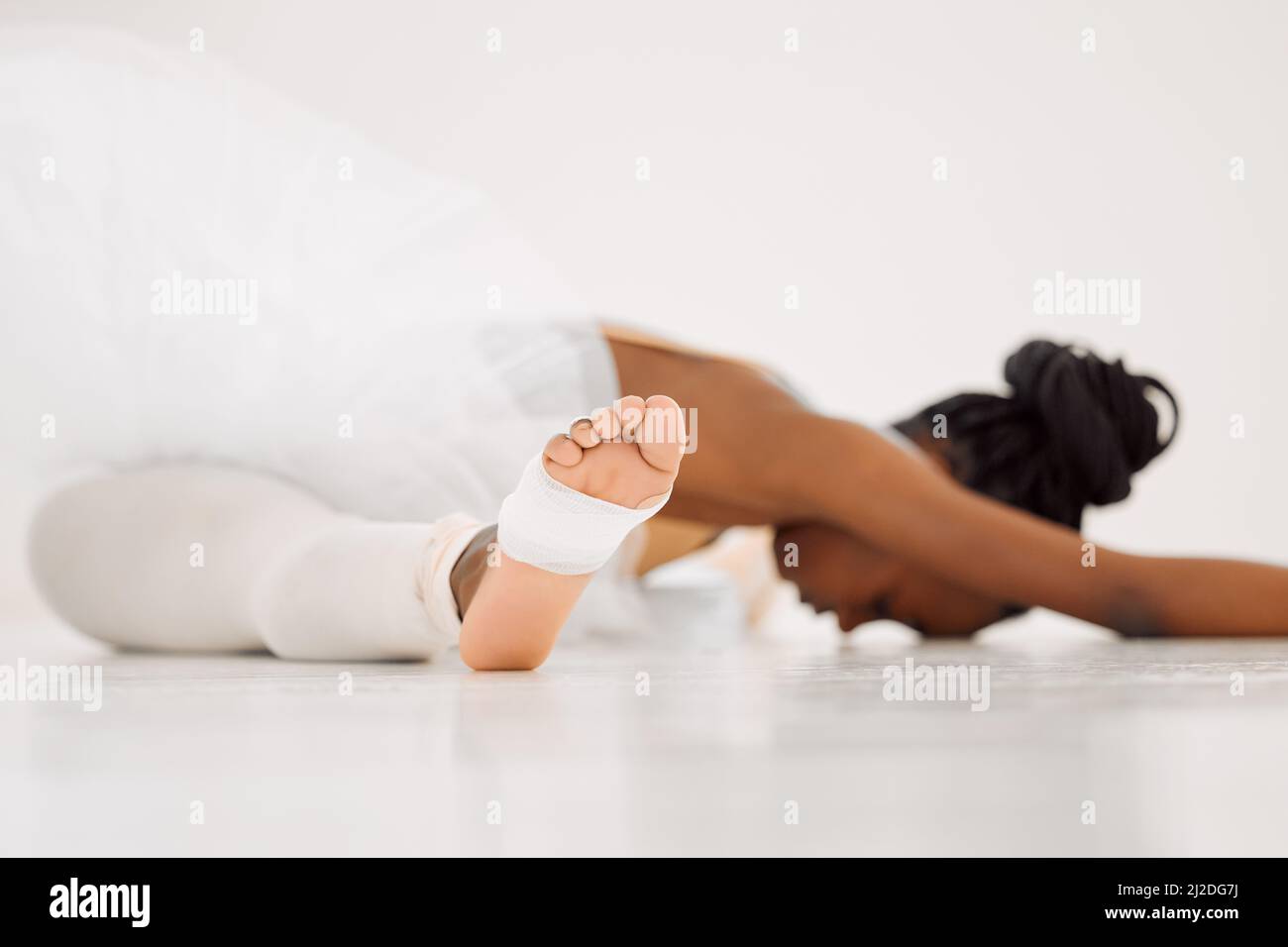 Always be prepared. Shot of a dancer stretching in a studio. Stock Photo