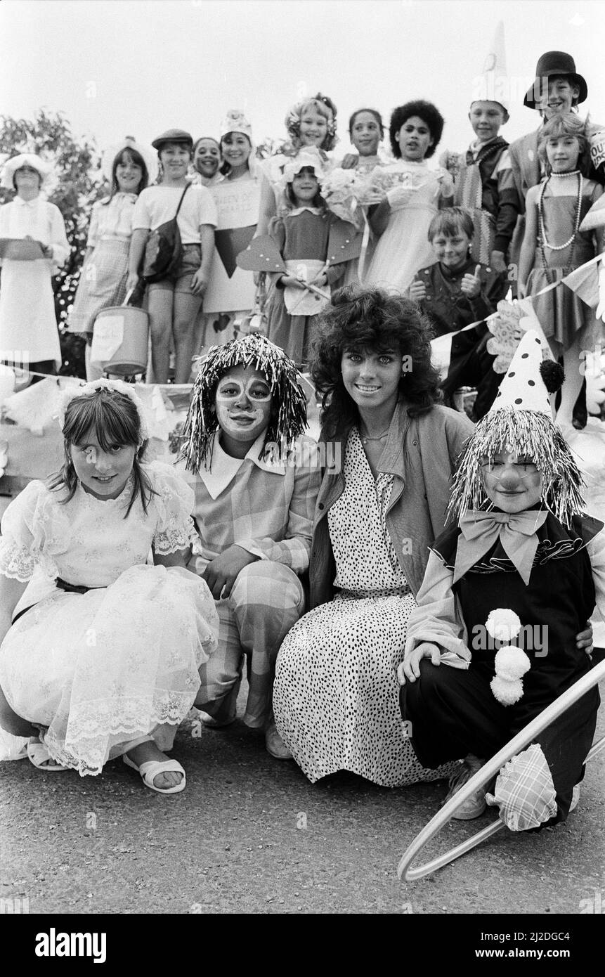 Miss Examiner Tracy O'Hehir judged the floats and fancy dress when Golcar Royal British Legion Club celebrated its diamond jubilee with a parade and carnival. Tracy is seen here with members of Milnsbridge Youth Club and their float. Paddock Youth Band lead the procession from the club to the carnival ground at Manor Road. Also taking part in the parade were Colne Valley Eagles majorettes, Marsden majorettes, cubs, scouts and guides, and Shire horses from the Tetley Brewery. The carnival was opened by the national chairman of the Royal British Legion, Mr Robert Scaife, from Heckmondwike, and t Stock Photo