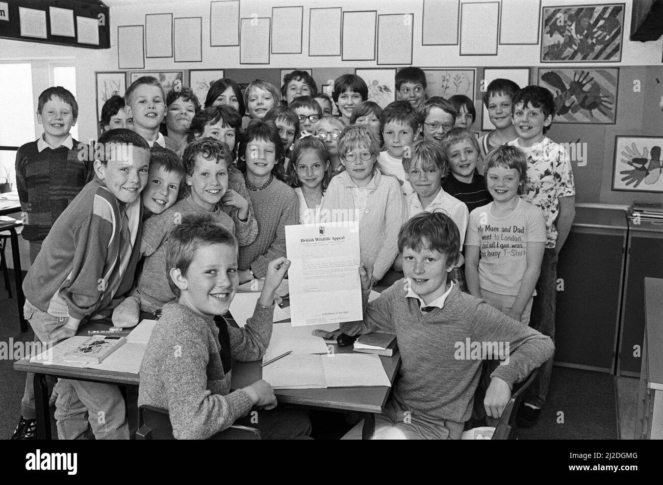 Thanks, children... Christopher Laycock (left) and Andrew Lindley, both 11, pictured with classmates, show a letter of appreciation from British Wildlife Appeal chairman David Attenborough. The letter was received by third and fourth-formers at Honley Junior School after pupils raised ¿200 for the Wildlife In Danger Appeal, with events which included a treasure hunt. 6th May 1986. Stock Photo