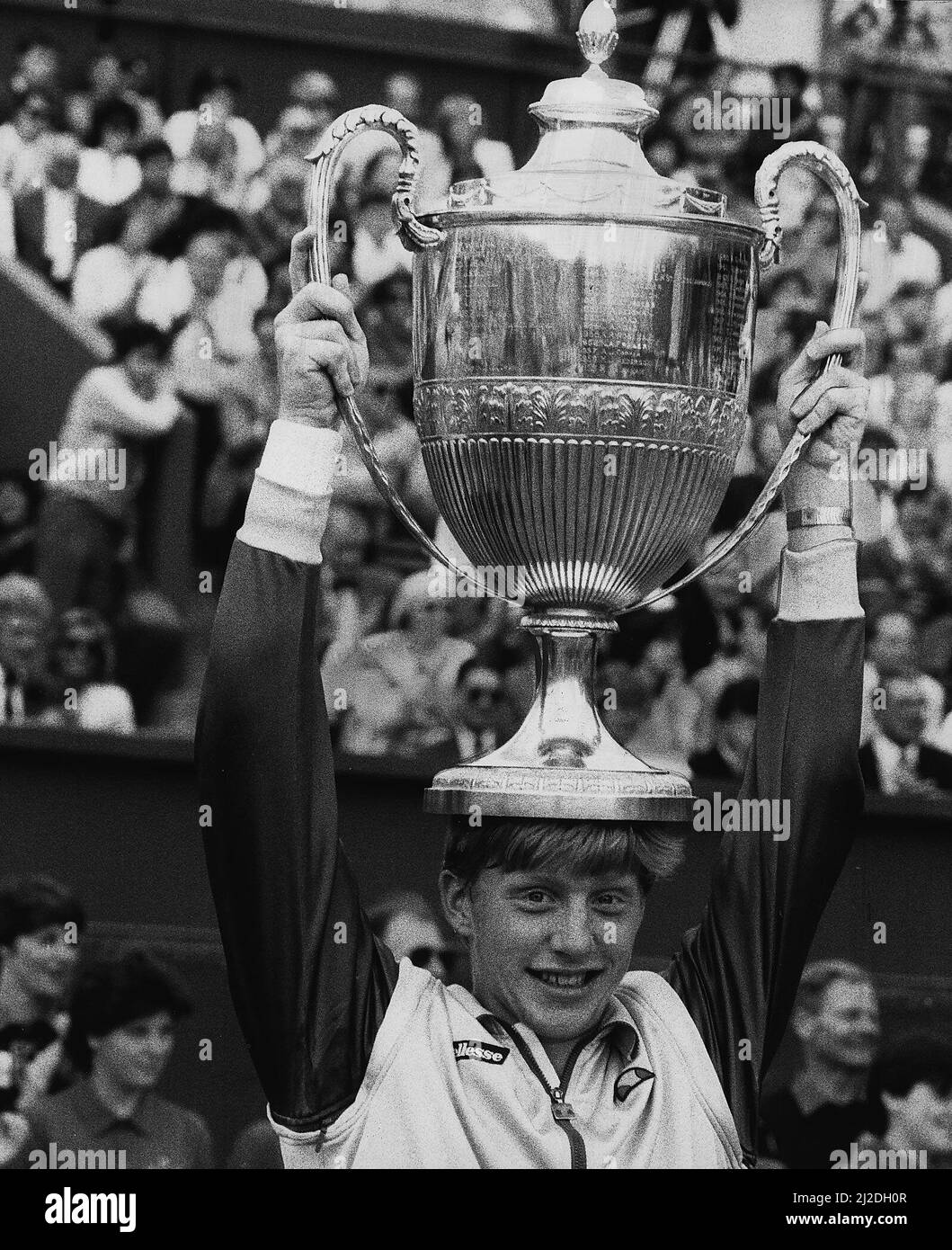 Boris Becker tennis holding the Wimbledon Trophy on top of his head after becoming the youngest winner of the mens title Stock Photo