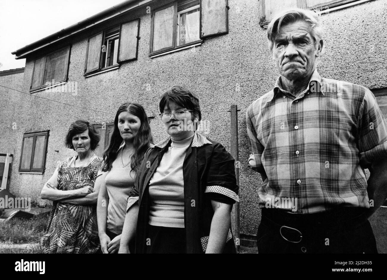 Mrs Eunice Lewis, Miss Janet Lewis, Miss Barbara Lewis and Mr John Lewis who live in a house for the homeless, described as a punishment block, on the Gurnos Estate. Two families occupy the house and share a bathroom and kitchen. 26th June 1986. Stock Photo