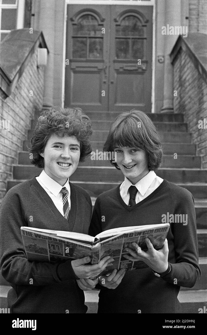 Reading up on their faraway destinations are Caroline Normanton (left) and Joanne Sharp, who have been chosen to represent North East England Guides for an experiment in international living. Caroline, 18, of Rastrick, an assistant guider with 3rd Rastrick St John's Brownies, will be going to Mexico. Joanne, 16, of Brighouse, a Brownie leader and Ranger with 3rd Rastrick, is off to Ecuador. The girls, who are both pupils of Brighouse High School, will set off in July for three weeks, staying with families. 7th March 1986 Stock Photo