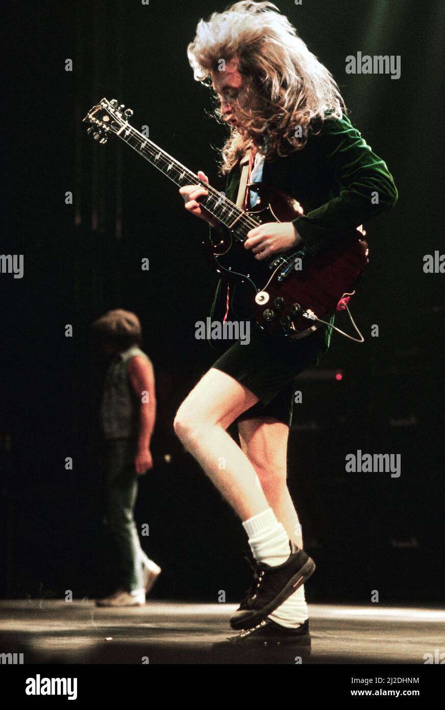Australian rock group AC/DC performing on stage at Wembley Arena  during their 'Fly On The Wall ' World tour.  Pictured is guitarist Angus Young. 16th January 1986. Stock Photo