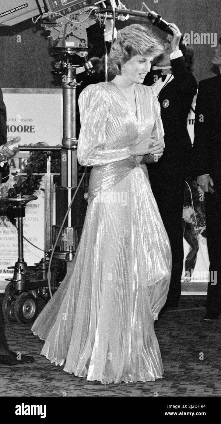 HRH The Princess of Wales, Princess Diana attends The Royal Premiere of the 14th 007 James Bond Movie, 'A View To A Kill'  at the Odeon Cinema, Leicester Square, London. In other frames in this set, The Princess is pictured talking to actor Roger Moore. This was Roger Moore's last of seven Bond Films. His first 'Live and Let Die', was released in 1973. And other frames where she laughs with Duran Duran who supplied the title song.  Princess Diana wears a stunning silver Bruce Oldfield dress.  Picture taken 14th June 1985 Stock Photo