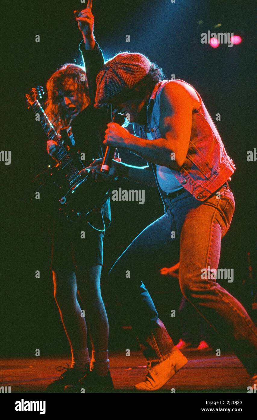 Australian rock group AC/DC performing on stage at Wembley Arena  during their 'Fly On The Wall ' World tour.  Pictured is singer Brian Johnson and guitarist Angus Young. 16th January 1986. Stock Photo