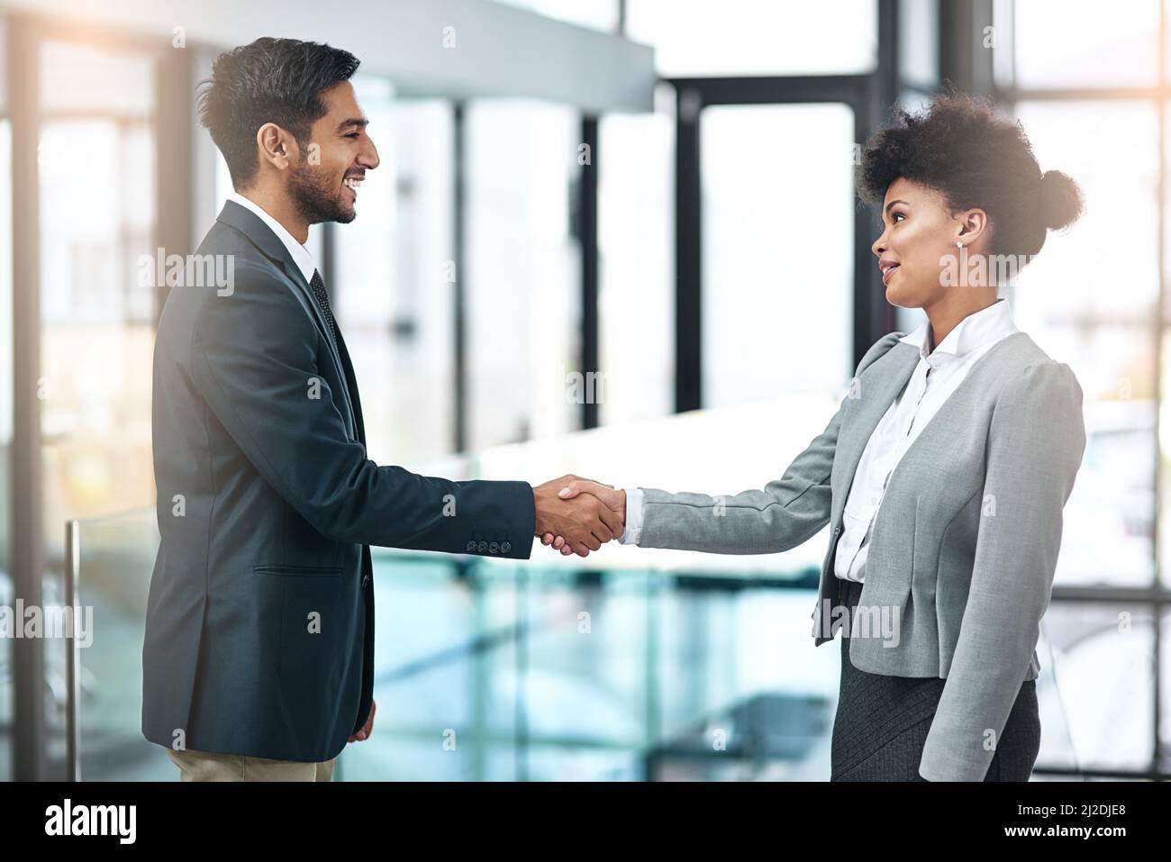 Offering a handshake with sincerity, confidence and authority. Shot of two businesspeople shaking hands. Stock Photo