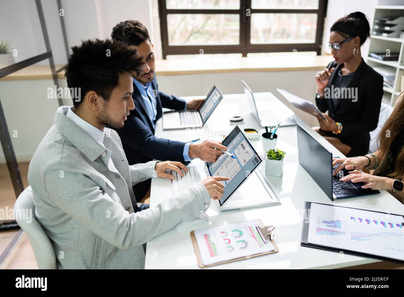 Business Invoice Tax Management. Accountant Using Monitor Stock Photo