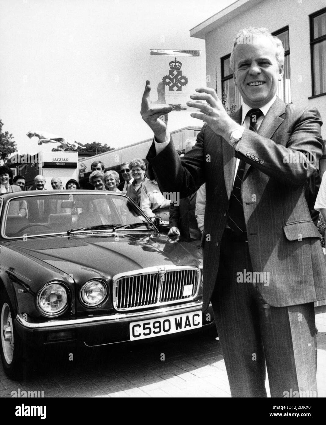 Sir John Egan shows the Queens Award for Export Achievement presented to him today by Lord Aylsford, Lord Lieutenant of the West Midlands. 26th June 1986. Stock Photo