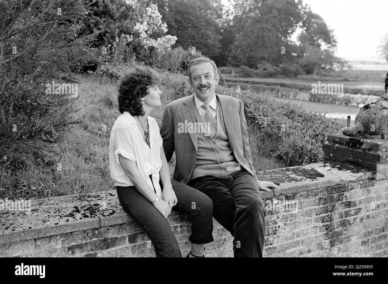 Pauline Collins and Roy Marsden on the set of 'The Black Tower' in Norfolk. 25th July 1985. Stock Photo