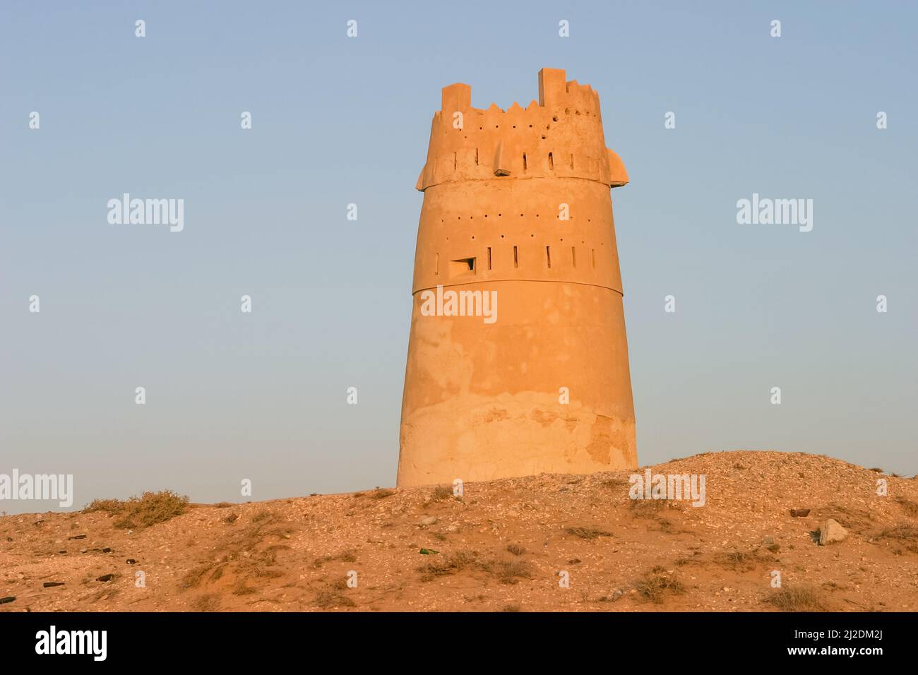One of the watch towers that guard the approach to Ras al Khaimah city in the United Arab Emirates. Note the mound of shells in the foreground. Stock Photo