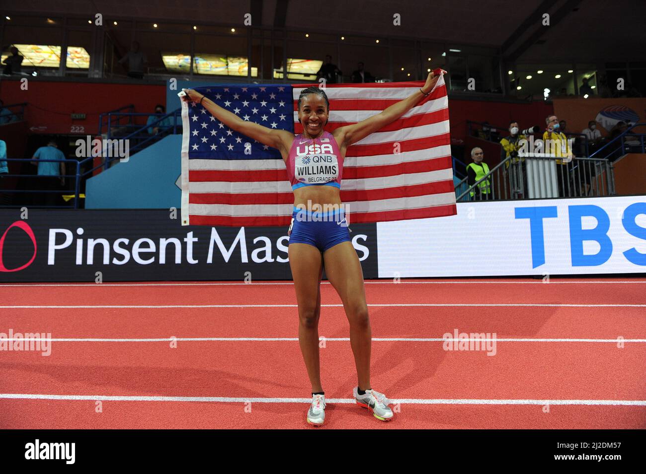 Kendell Williams (USA) poses with United States flag after finishing