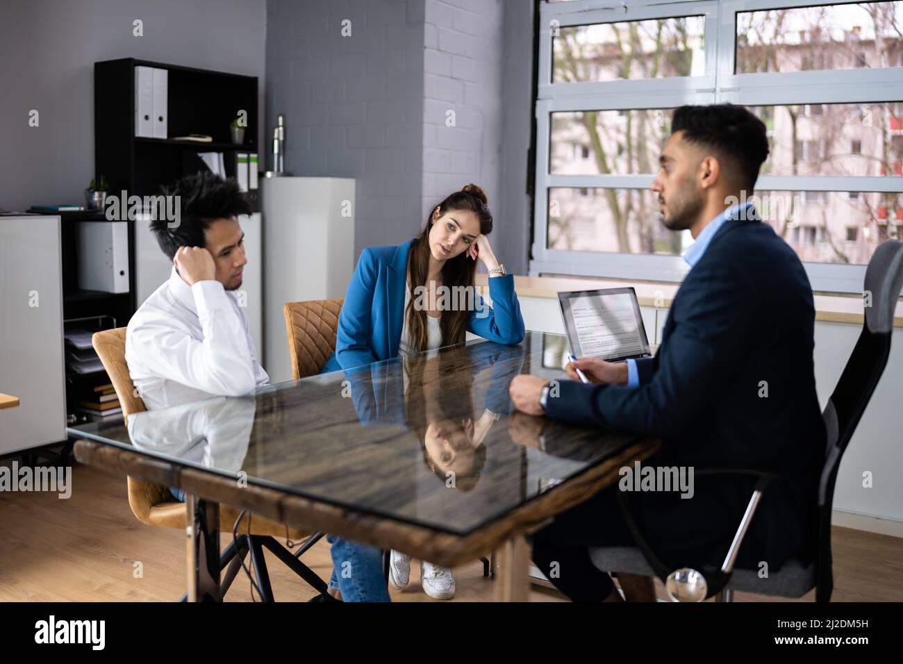 Angry Sad Family With Lawyer. Couple Divorce Dispute Stock Photo