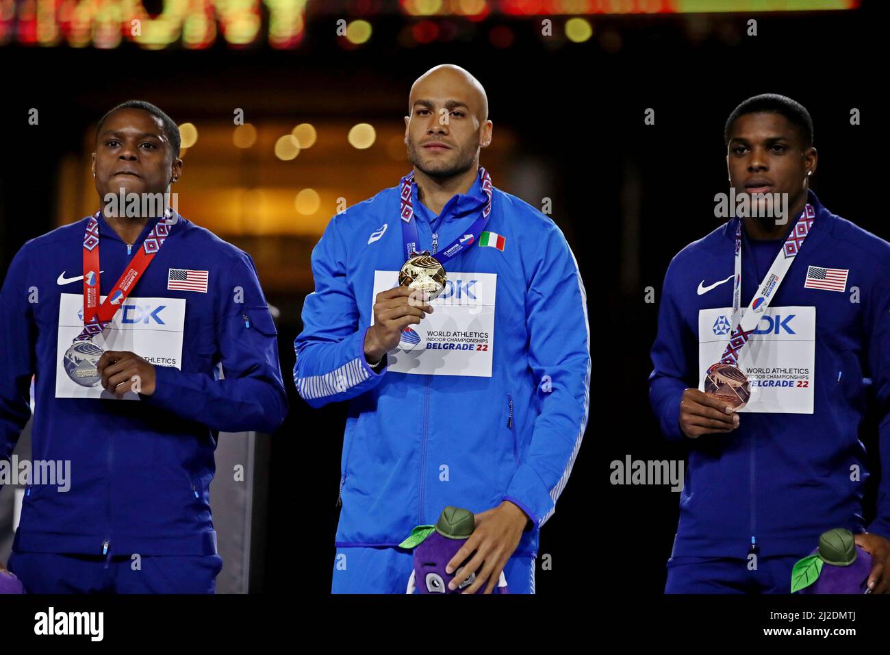 Men's 60m gold medalist Lamont Marcell Jacobs (GRE), center, poses with silver medalist Christian Coleman (USA), left, and bronze medalist Marvin Brac Stock Photo