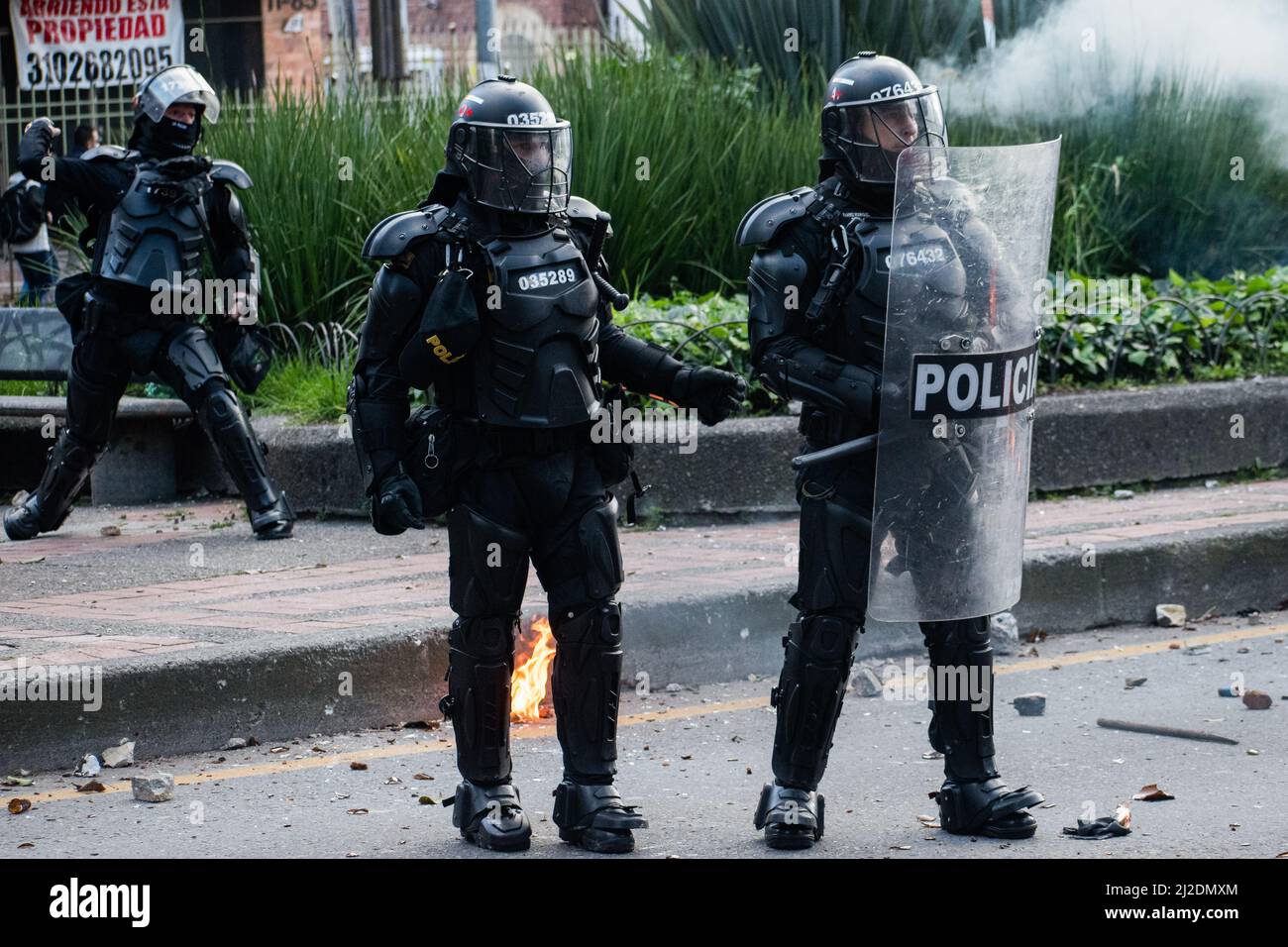Colombia's riot police officers 'ESMAD' use shields and tear gas as students protested against Colombia's national police and government on March 31, 2022 in Bogota, Colombia. As demonstrators and Colombia's riot police squad 'ESMAD' ended up in clashes in northern Bogota. Photo by: Daniel Romero/Long Visual Press Stock Photo