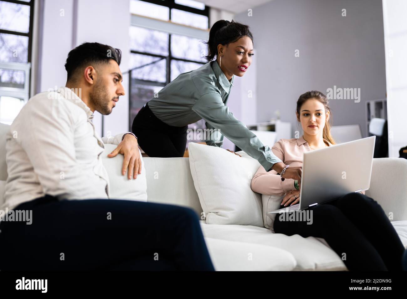 Young Diverse People Using Laptops In Coworking Space Stock Photo - Alamy