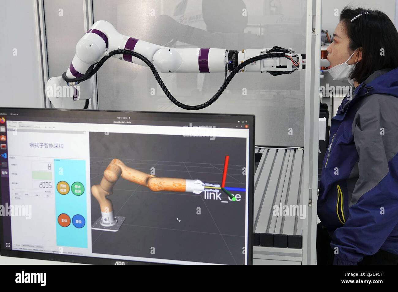 YANTAI, CHINA APRIL 1, 2022 A throat swab nucleic acid sampling robot (functional display