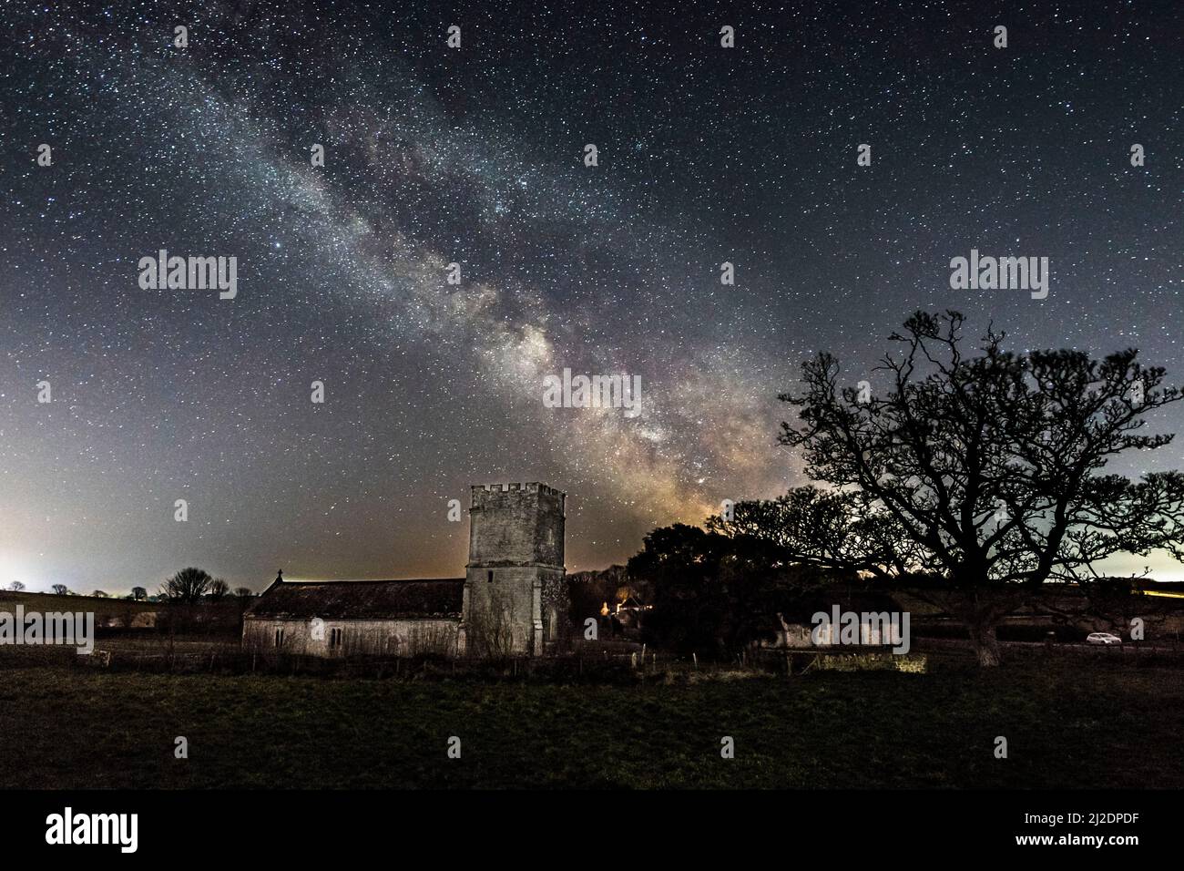 Whitcombe, Dorset, UK.  1st April 2022.  UK Weather.   The Milky Way glows brightly in the cold clear night sky above the historic church at Whitcombe near Dorchester in Dorset.  Picture Credit: Graham Hunt/Alamy Live News Stock Photo