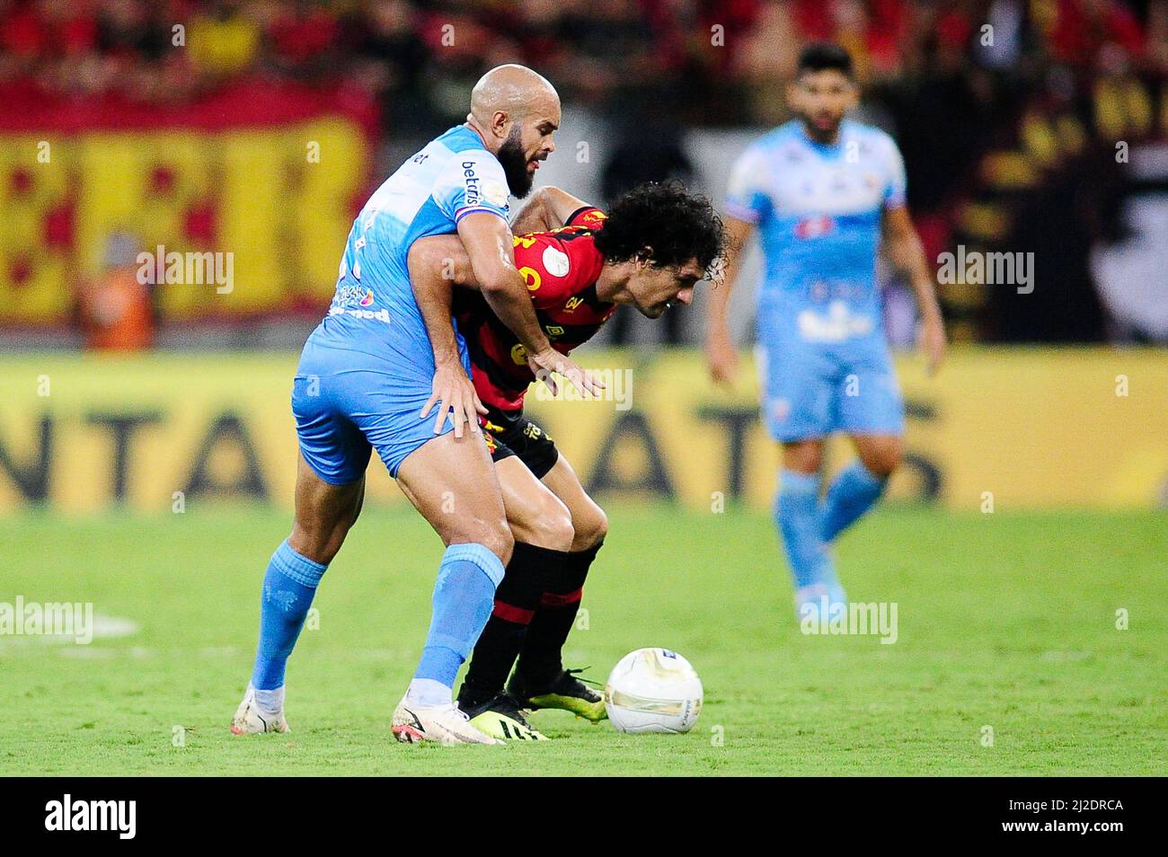 SÃO LOURENÇO DA MATA, PE - 31.03.2022: SPORT X FORTALEZA - Midfielders Zé Welison (Fortaleza - left) and Blas Cáceres (Sport - center - with the ball) during the game between Sport x Fortaleza, valid for the first match of the Copa do Nordeste 2022 final, held at the Arena de Pernambuco, in São Lourenço da Mata (PE), this Thursday (31). (Photo: Ricardo Fernandes/Spia Photo/Fotoarena) Stock Photo