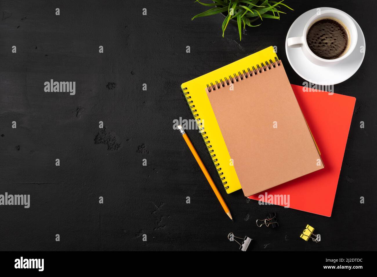 Three notepads on a black table close up Stock Photo