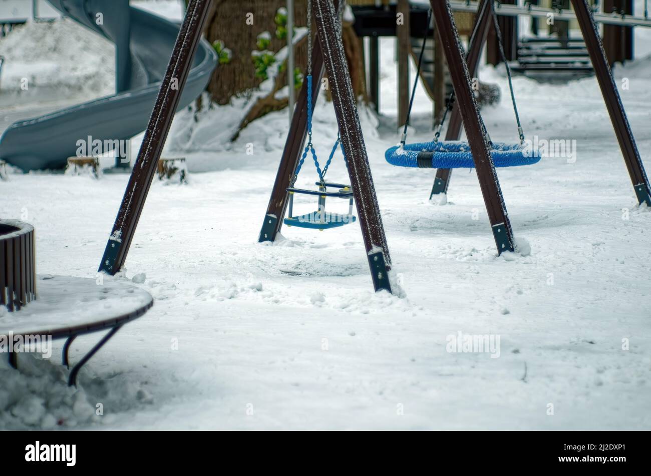 children's playground in the park, in winter Stock Photo - Alamy