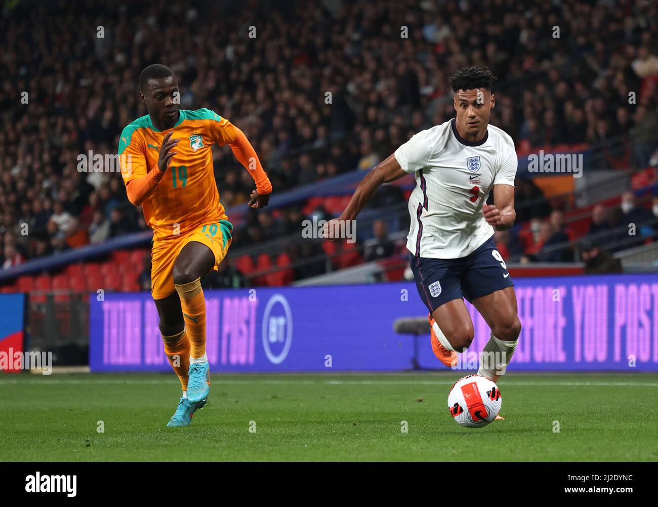London, UK. 29th Mar, 2022. Nicholas Pepe (IC) Ollie Watkins (E) at the