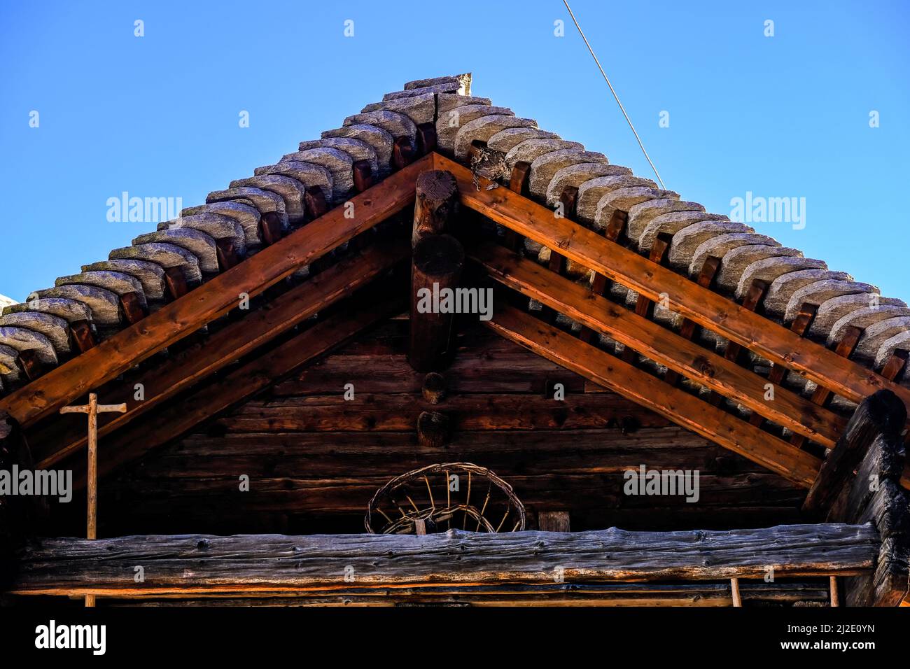 Traditional wooden house with stone roof in Calanca Valley, Ticino region, Switzerland Stock Photo