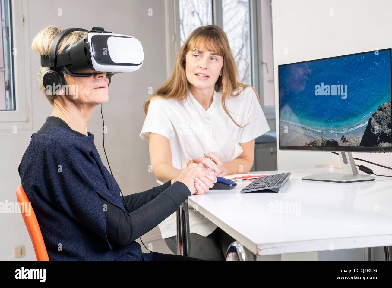 Elderly woman in virtual reality headset Stock Photo Alamy