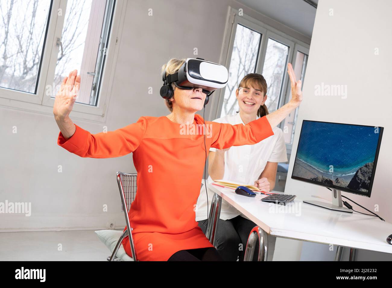 Elderly woman in virtual reality headset Stock Photo Alamy