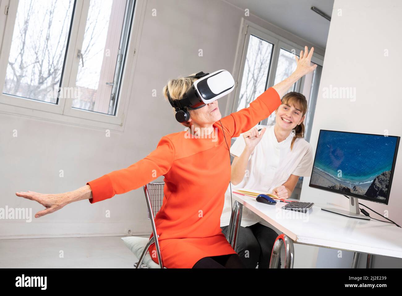 Elderly woman in virtual reality headset Stock Photo Alamy