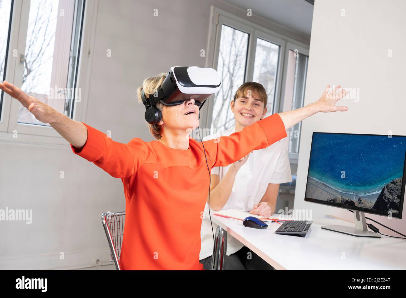 Elderly woman in virtual reality headset Stock Photo Alamy