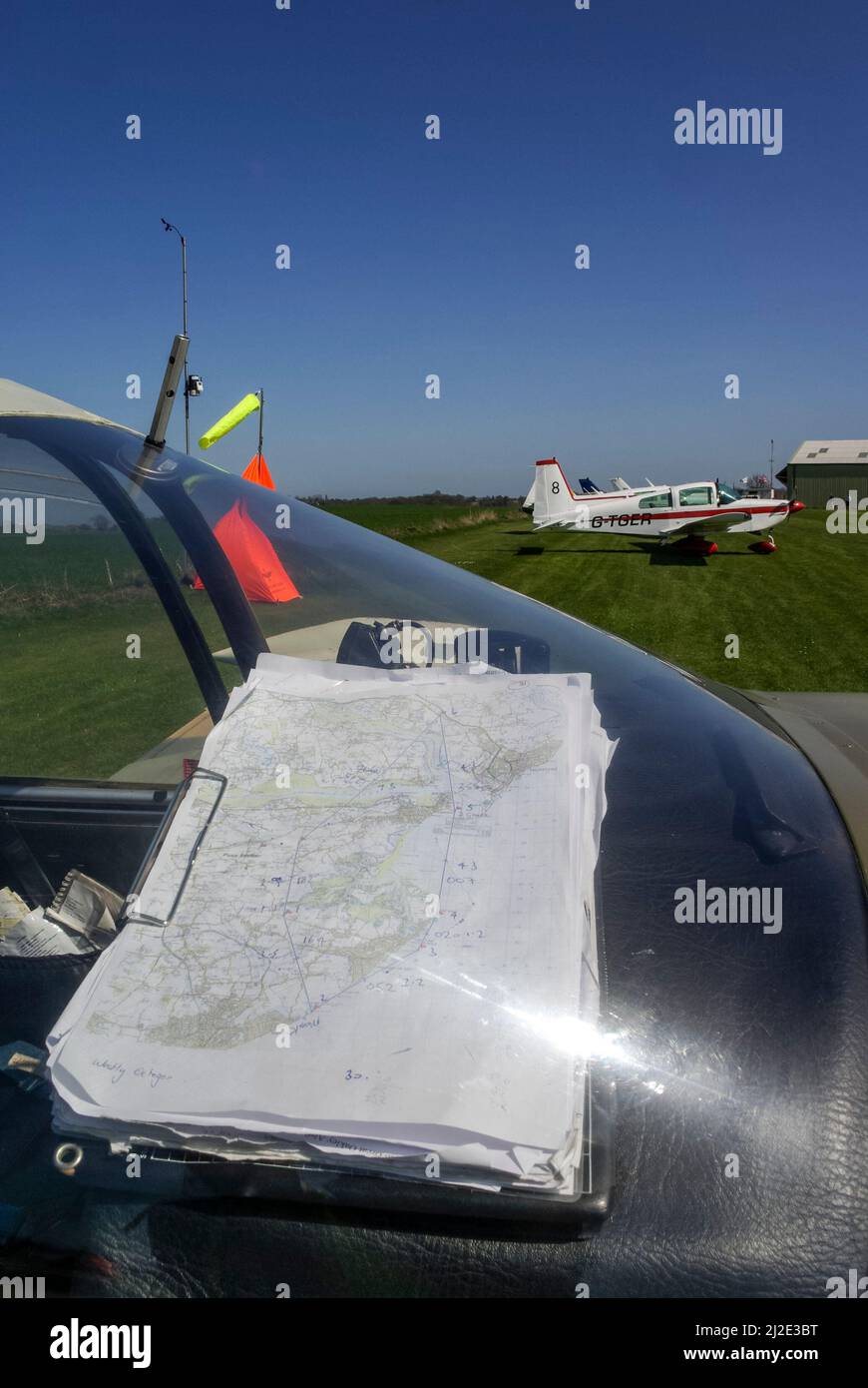 Race circuit map in cockpit of  plane, with AA-5B Tiger G-TGER at Great Oakley airstrip in Essex ready to compete in the Royal Aero Club Air Race Stock Photo