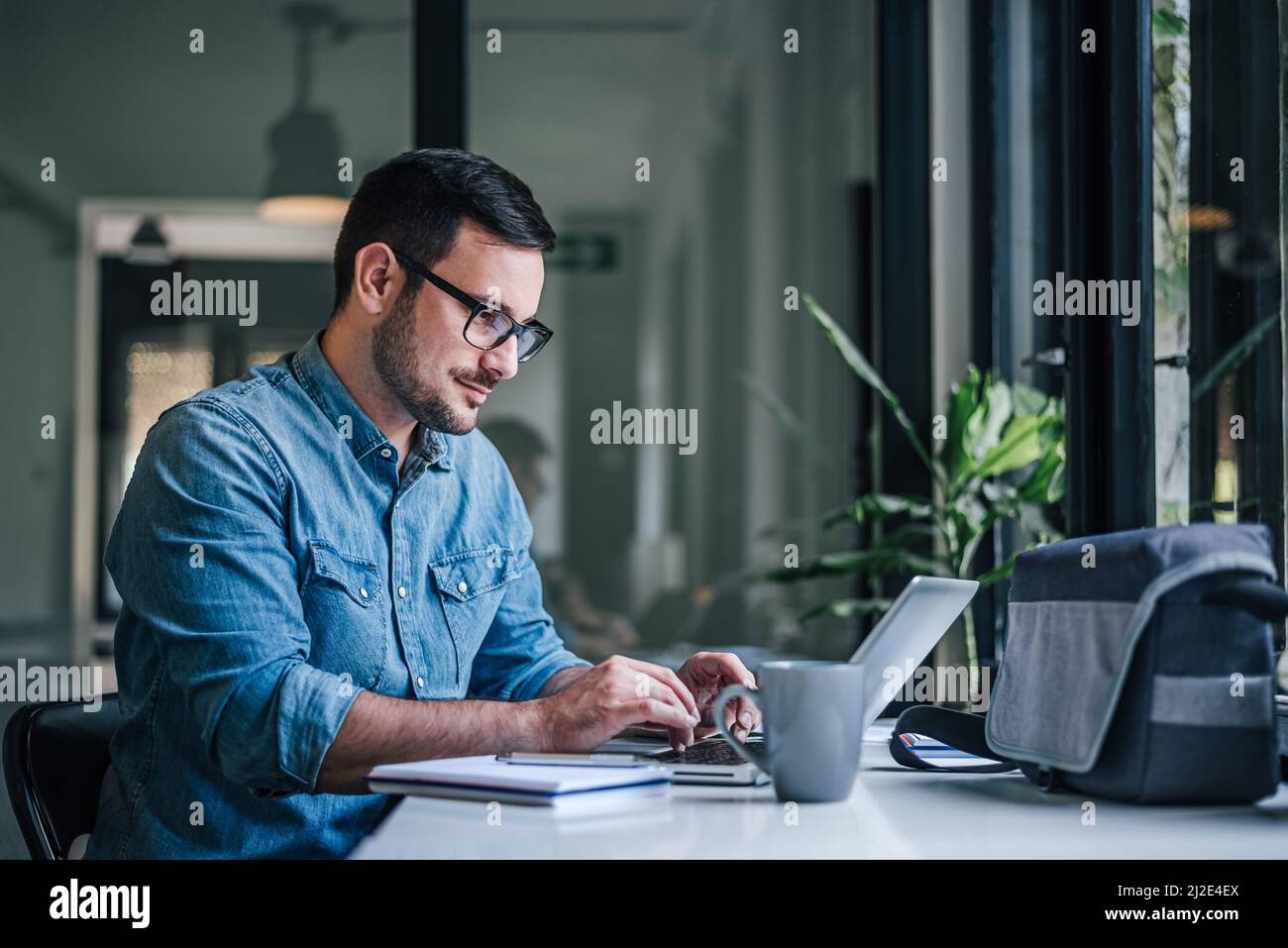 Hardworking executive, browsing the internet for information Stock ...