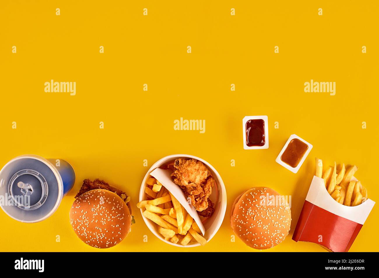 Fast food dish top view. Meat burger, potato chips and wedges. Take