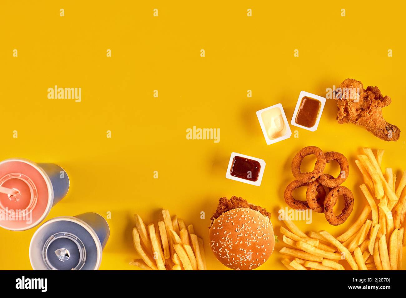 Fast food dish top view. Meat burger, potato chips and wedges. Take