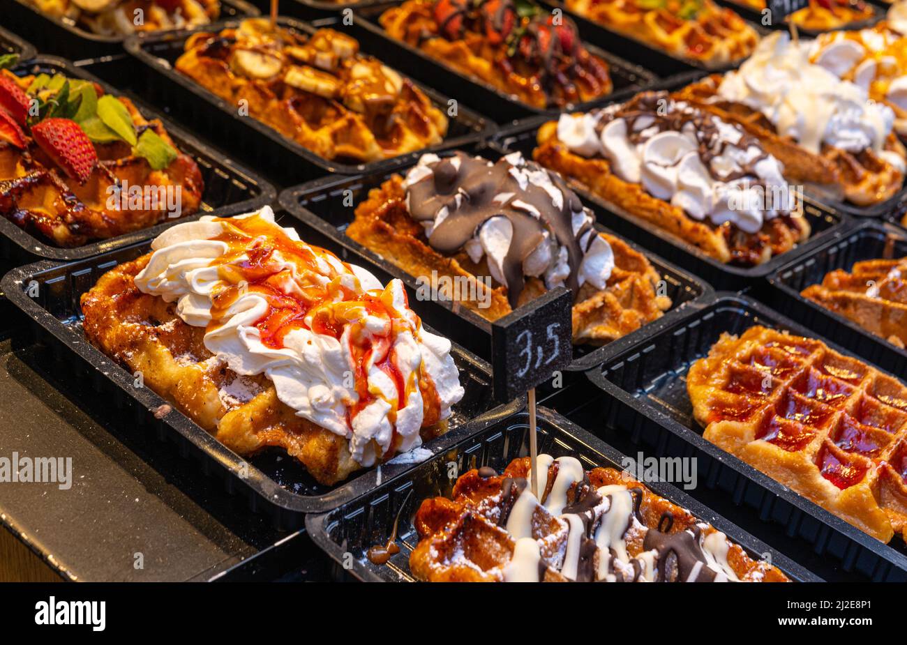 Belgian waffles with colorful toppings on showcase. Brussels Stock Photo Alamy