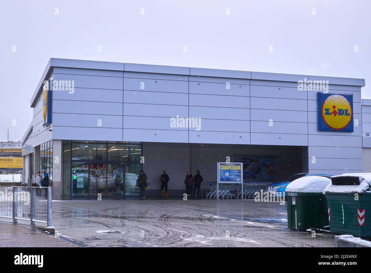 Pamplona, Navarra Spain april 01 2022, Surprise snowfall in early spring lidl parking lot Stock Photo