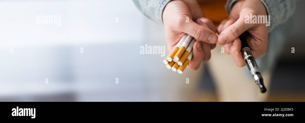 Smoking Tobacco E Cigarette. Holding Tobacco Vape Stock Photo