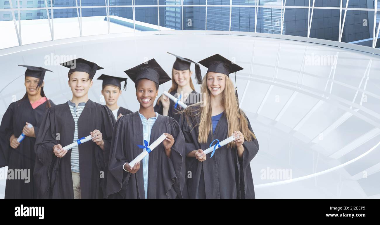 Composite image of group of graduates holding their degrees against ...