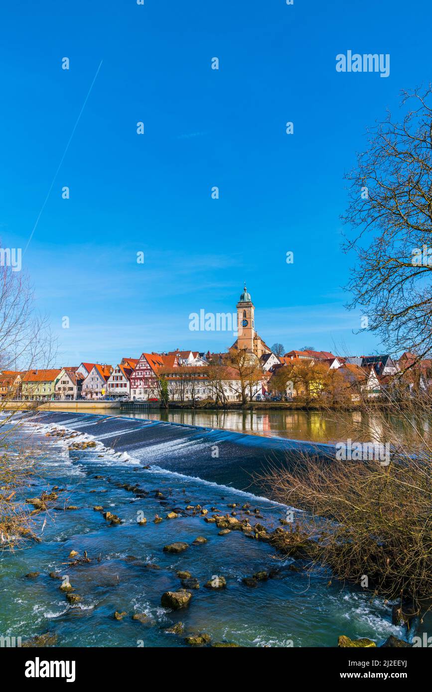 Germany, Nuertingen city houses nature landscape at waterfront of neckar river reflecting in beautiful sunny atmosphere, a nice place to visit Stock Photo