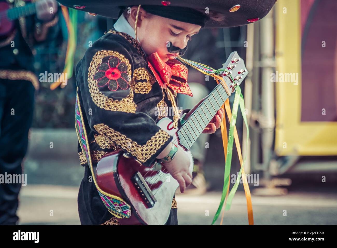 Portugal Carnival - Young boy dressed as Mexican playing the guitar -  Ovar, Grande Desfile. Big Parade, Pindéricus Grupo de Carnaval. Stock Photo
