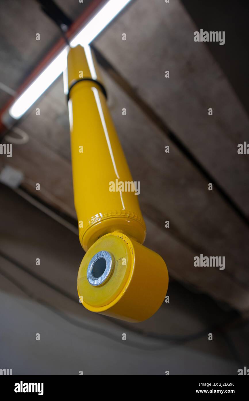 Detail of new shock absorber eyelet with visible polyurethane bushing