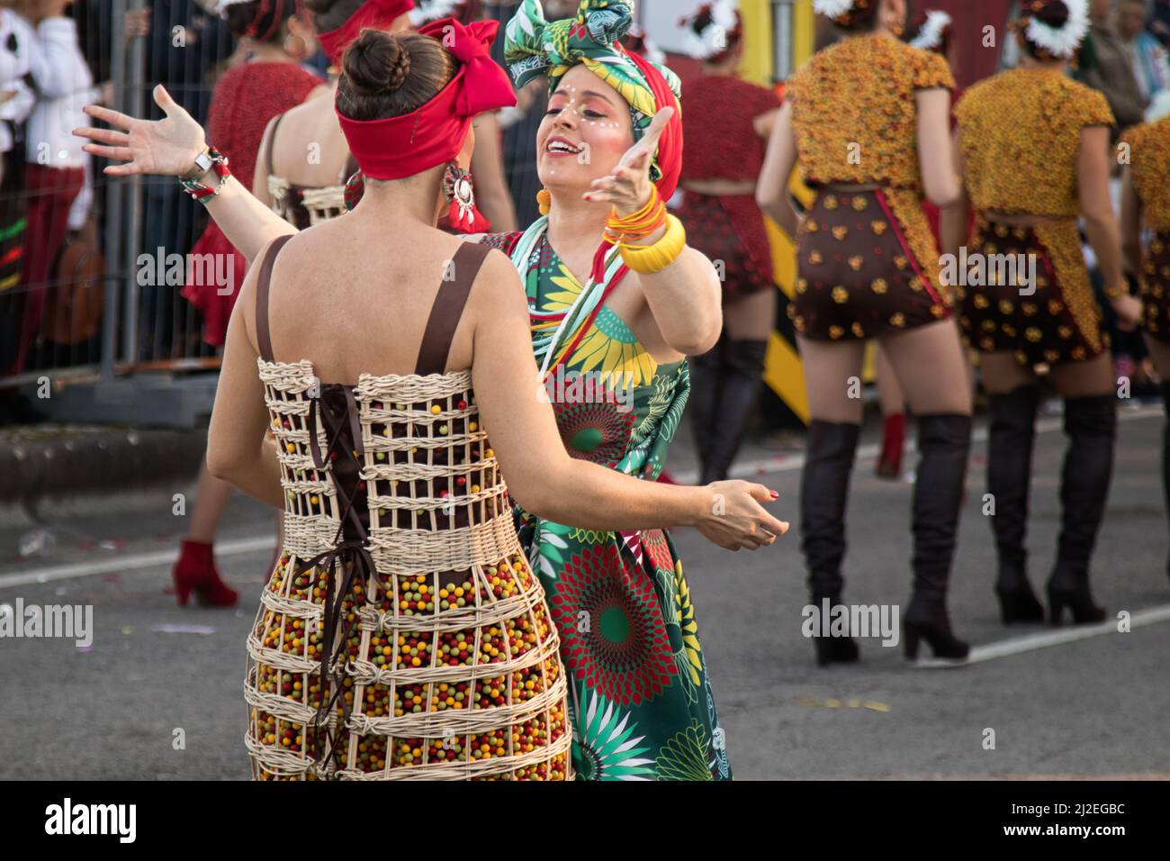 Two masqueraders greeting each other - Ovar, Grande Desfile. Big Parade. Palachinas, Rota do Café, The Coffee Road Stock Photo