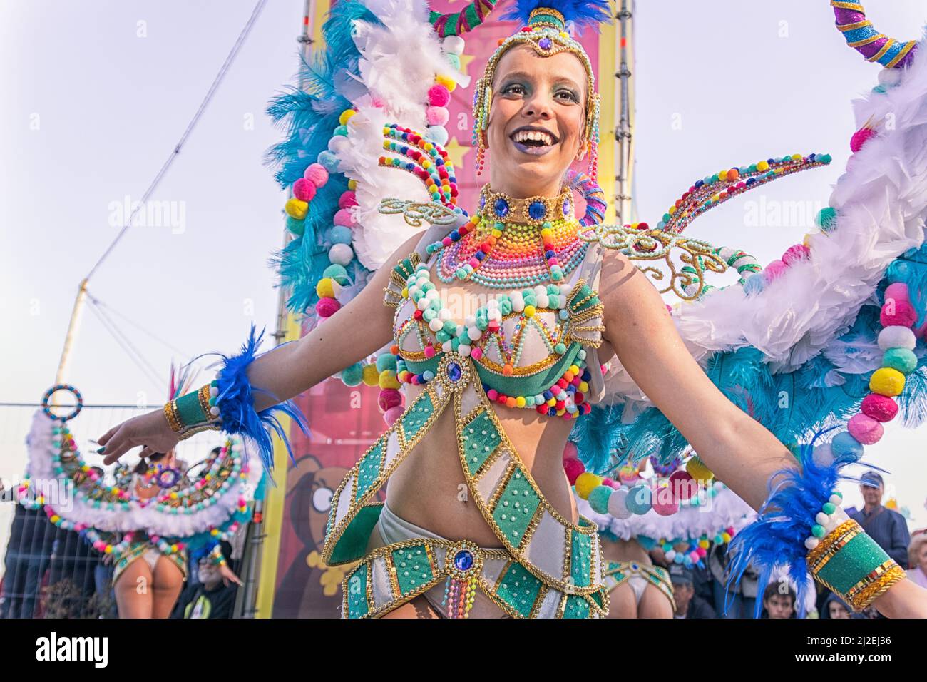 Portugal Carnaval - Female Masquerader dancing and smiling at the Ovar 'Grande Desfile' or Big Parade Stock Photo