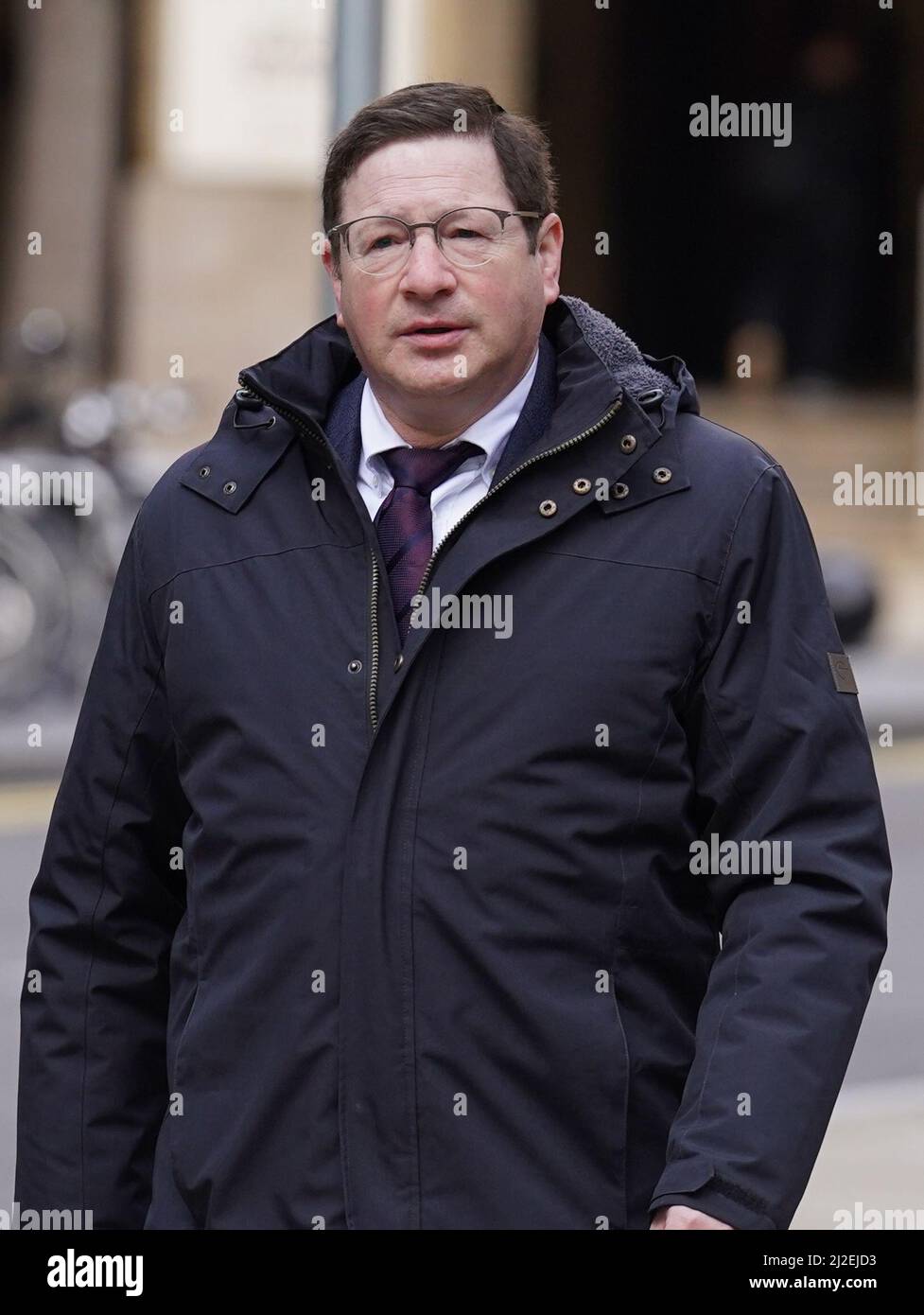 Alan Moher, 57, (right) arrives at Southwark Crown Court in London 