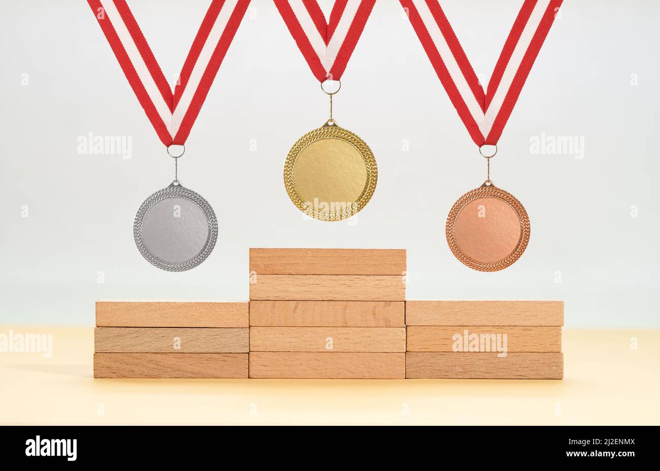 Platform made of wooden blocks and gold silver and bronze medals as a ...