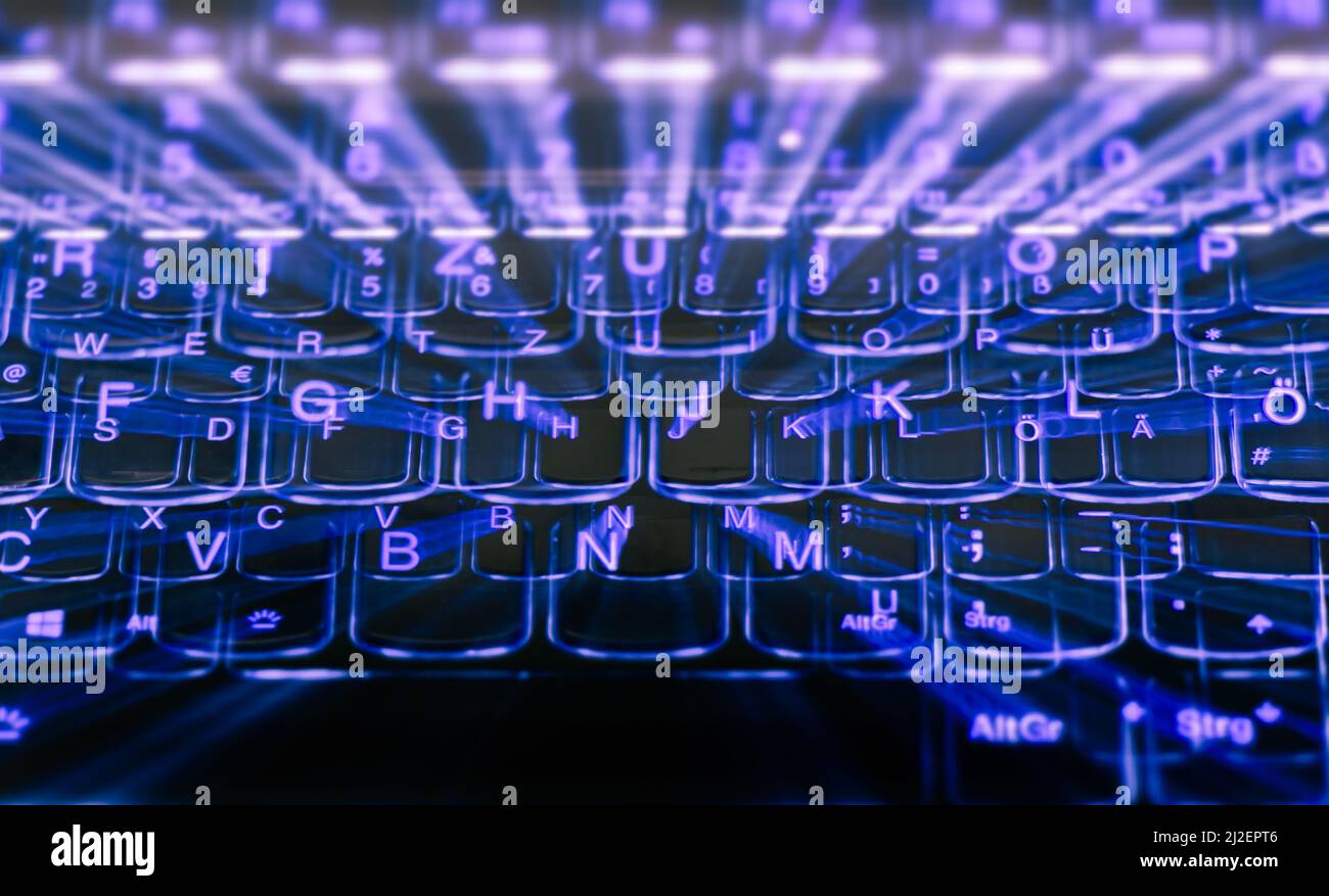 Zoom-Effekt einer beleuchteten Laptop-Tastatur, Zoom effect of an  illuminated laptop keyboard Stock Photo - Alamy
