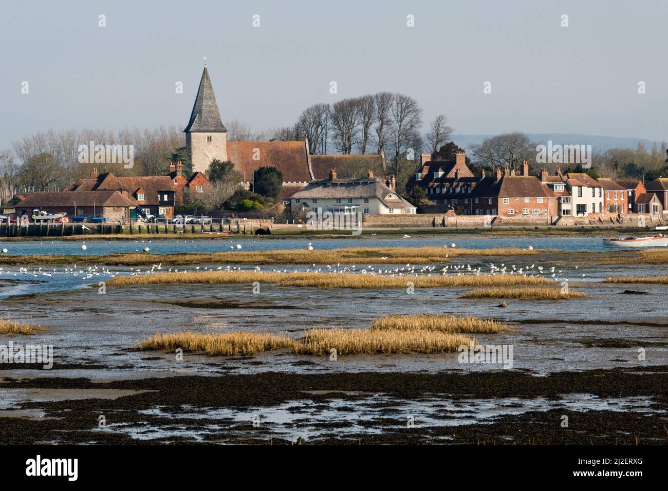 The popular coastal village of Bosham, West Sussex, UK. The tide is seen partly out. Stock Photo