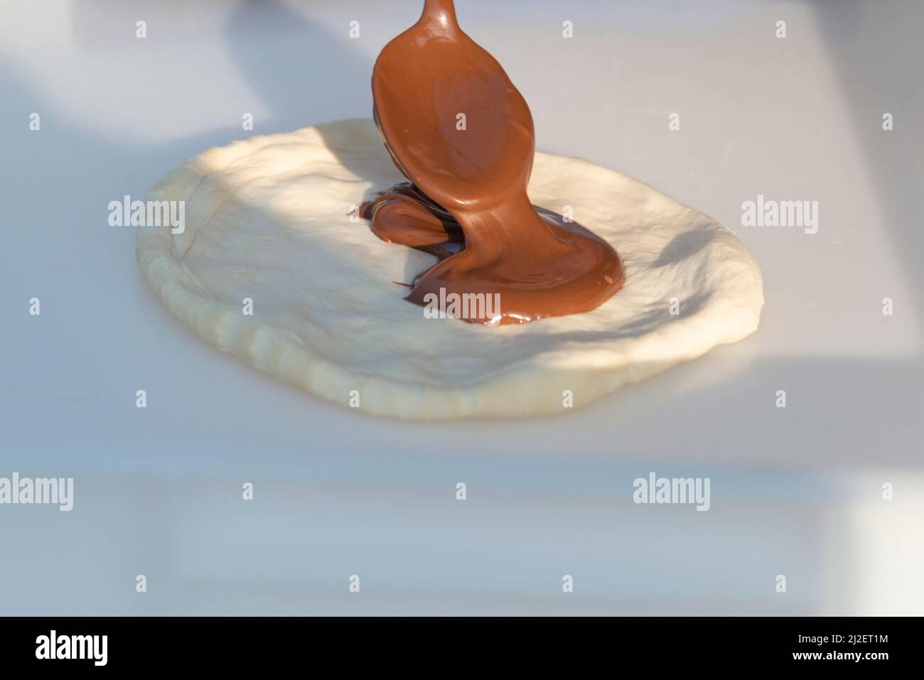 Italy, Lombardy, Street Food, Preparation of Fitters Filled with Chocolate Cream Stock Photo