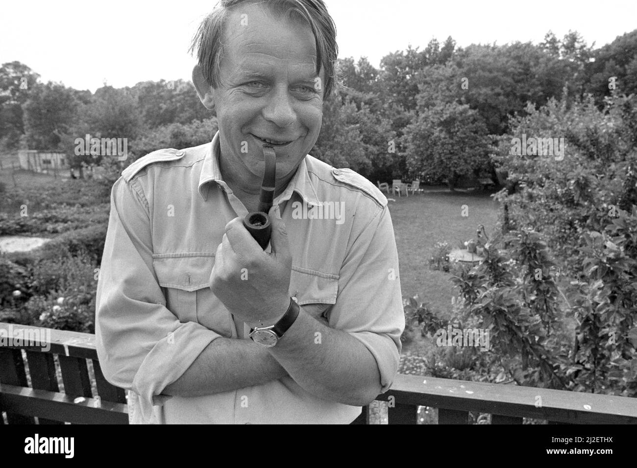 Culture/literature The writer Siegfried LENZ, stands at a garden fence, in his left hand a pipe, Lebollykke, July 1st, 1973, Â Stock Photo