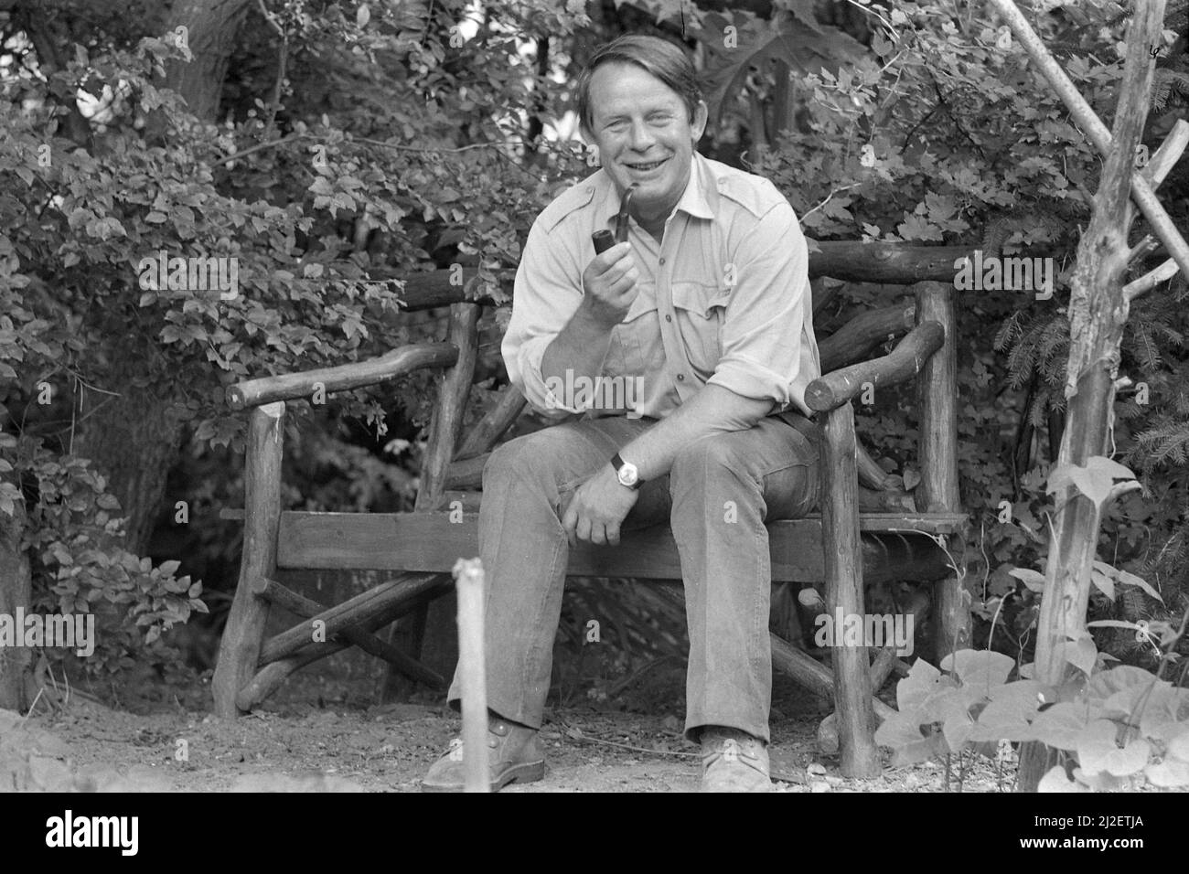 Culture/literature The writer Siegfried LENZ, sitting on a bench, holding a pipe in his right hand, Lebollykke, July 1st, 1973, Â Stock Photo